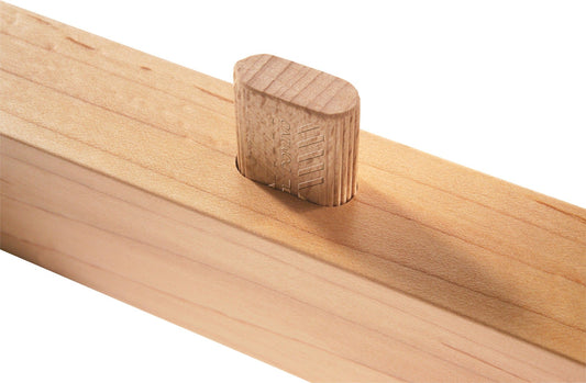 Festool DOMINO Dübel Sipo auf Holz, quadratisches Profil mit Führungsrippen und Leimtaschen sichtbar.