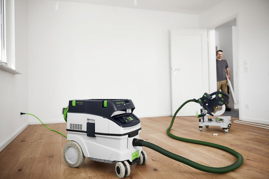 Festool Absaugmobile CT 36 E mit Radüberzieher RD-CT 26-36-Set auf Parkettboden in Wohnraum